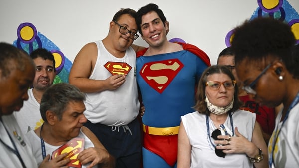 Leonardo Muylaert poses with patients of the Association of Parents and Friends of Neurodivergent People (APAE-RIO) in the Tijuca neighbourhood in Rio de Janeiro Photos: Getty Images