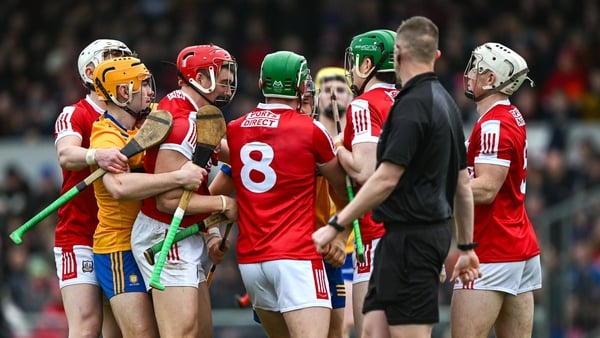 Referee Paul Faloon keeps a close eye as players jostle during All Ireland finalists Clare and Cork's National League clash earlier this year. Photo: Sportsfile