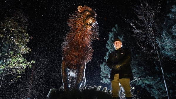 Douglas Gresham, the son CS Lewis stands beside a sculpture of Aslan as he helps open CS Lewis Square on November 23, 2016 in Belfast.