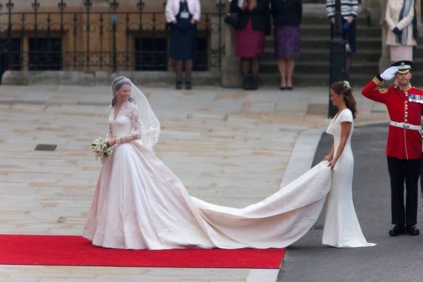 The Princess of Wales arrives at Westminster Abbery in a long-sleeve white gown with her sister, Pippa Middleton