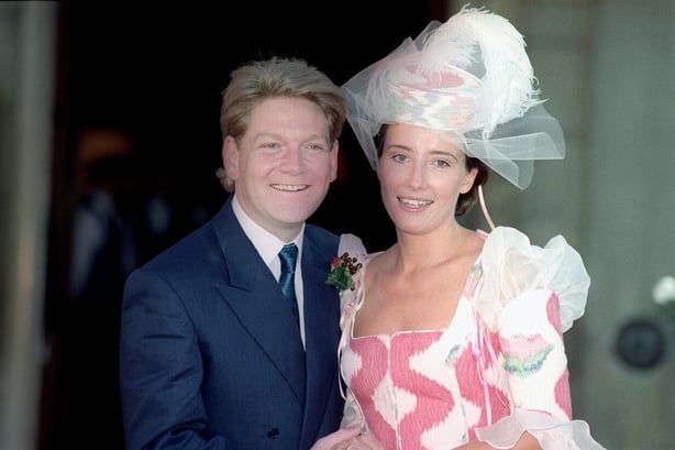 Emma Thompson wear pink and white long sleeved dress with matching hat outside wedding reception with her husband Kenneth Branagh